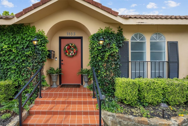 1803 Michael Ct, Arlington, TX 76010 - doorway to property featuring stucco siding and a tile roof