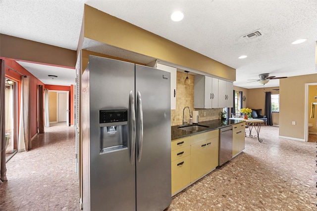 1803 Michael Ct, Arlington, TX 76010 - kitchen featuring appliances with stainless steel finishes, a sink, ceiling fan, decorative backsplash, and baseboards