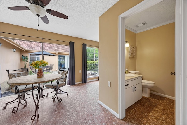 1803 Michael Ct, Arlington, TX 76010 - dining area featuring a ceiling fan, a textured ceiling, baseboards, and crown molding