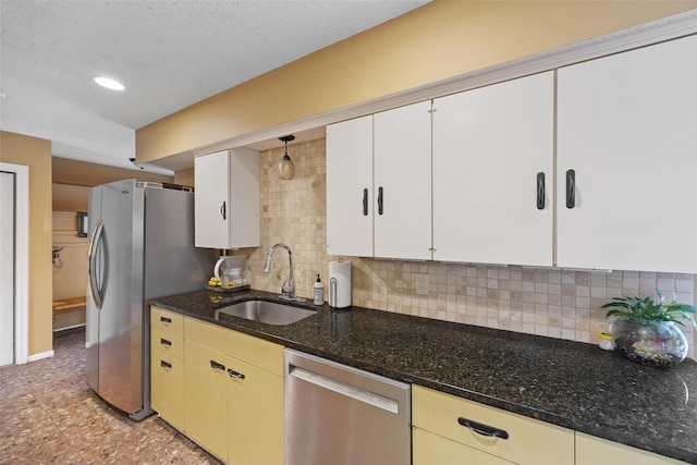 1803 Michael Ct, Arlington, TX 76010 - kitchen featuring appliances with stainless steel finishes, a sink, backsplash, dark stone counters, and recessed lighting