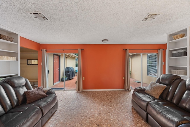 1803 Michael Ct, Arlington, TX 76010 - living area featuring a textured ceiling, built in shelves, and baseboards