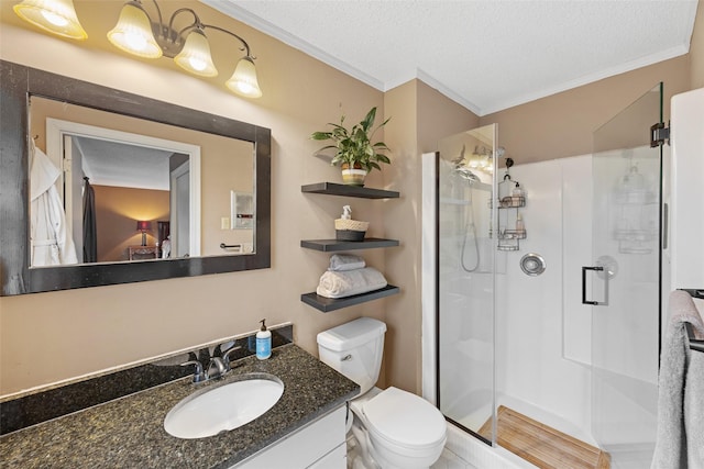 1803 Michael Ct, Arlington, TX 76010 - full bathroom featuring ornamental molding, a shower stall, vanity, toilet, and a textured ceiling