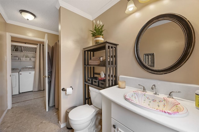1803 Michael Ct, Arlington, TX 76010 - full bathroom featuring washer and clothes dryer, vanity, ornamental molding, toilet, and baseboards
