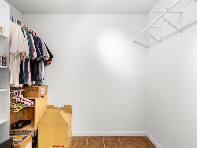 spacious closet featuring tile patterned flooring