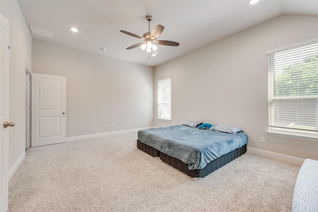 carpeted bedroom with baseboards, lofted ceiling, multiple windows, and recessed lighting
