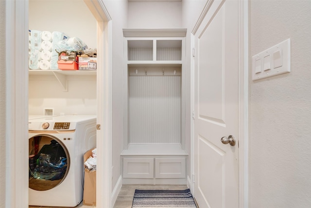 clothes washing area with laundry area and washer / clothes dryer