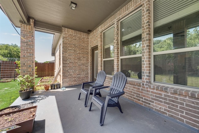 view of patio featuring fence