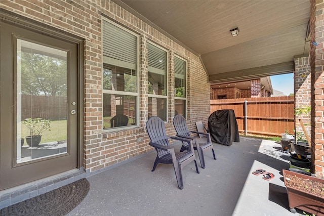 view of patio featuring fence
