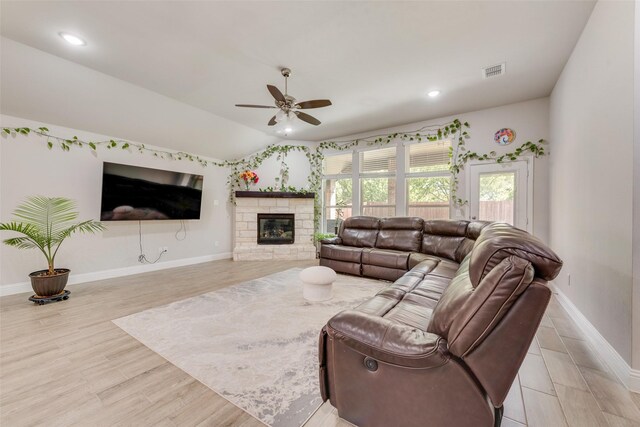 living room featuring visible vents, ceiling fan, baseboards, and lofted ceiling