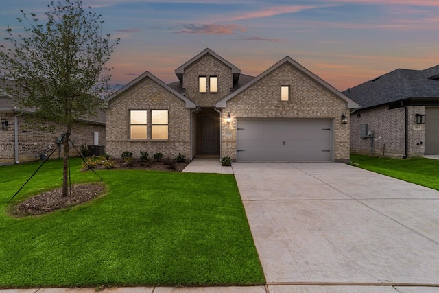 3616 Hickory St, Sherman, TX 75092 - view of front of property with a garage, brick siding, and a lawn