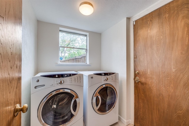 washroom featuring independent washer and dryer and laundry area