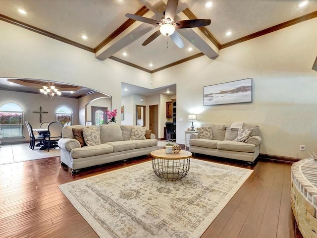 194 Royal Pnes, Lufkin, TX 75904 - living area with a ceiling fan, arched walkways, a chandelier, wood-type flooring, and ornamental molding