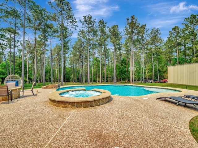194 Royal Pnes, Lufkin, TX 75904 - view of pool featuring a patio, a pool with connected hot tub, and view of scattered trees
