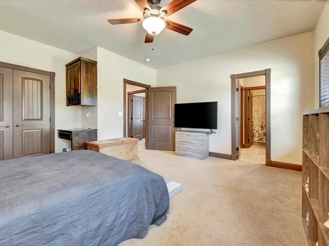194 Royal Pnes, Lufkin, TX 75904 - bedroom with baseboards, light carpet, a closet, a ceiling fan, and ensuite bathroom