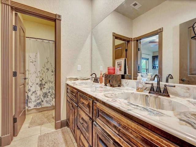 194 Royal Pnes, Lufkin, TX 75904 - bathroom featuring double vanity, tile patterned flooring, and a textured wall