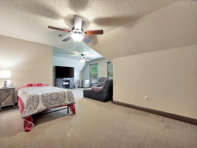 194 Royal Pnes, Lufkin, TX 75904 - bedroom featuring carpet floors, vaulted ceiling, a textured ceiling, ceiling fan, and baseboards