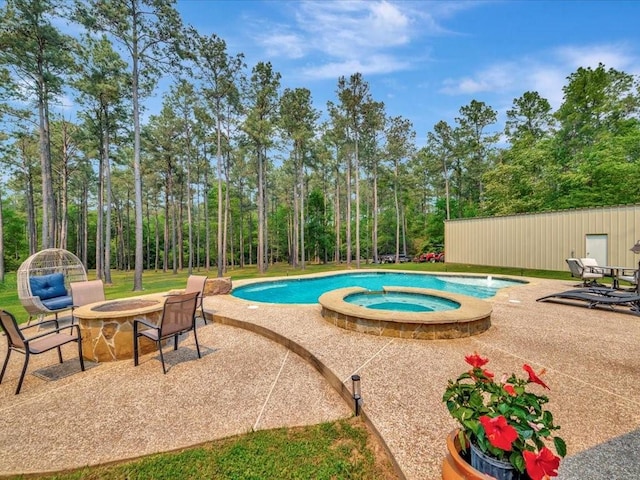 194 Royal Pnes, Lufkin, TX 75904 - view of pool with a patio, an outdoor fire pit, and a pool with connected hot tub