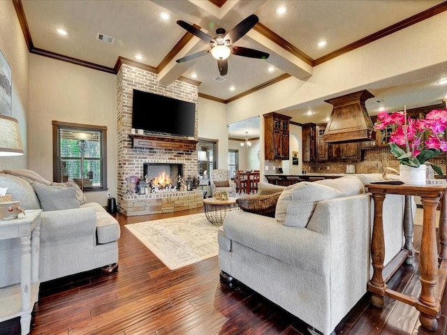 194 Royal Pnes, Lufkin, TX 75904 - living room featuring ornamental molding, ceiling fan, a brick fireplace, dark wood finished floors, and recessed lighting