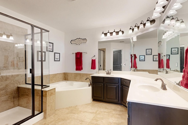6948 Carrington Ln, Fort Worth, TX 76137 - full bath with double vanity, a garden tub, a sink, and a stall shower