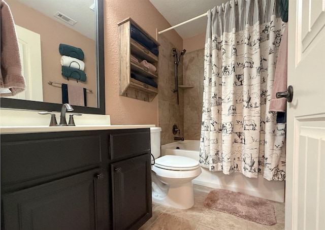 6948 Carrington Ln, Fort Worth, TX 76137 - full bath featuring vanity, tile patterned floors, toilet, visible vents, and shower / bath combo with shower curtain