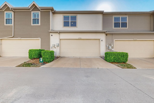 6948 Carrington Ln, Fort Worth, TX 76137 - townhome / multi-family property featuring a garage