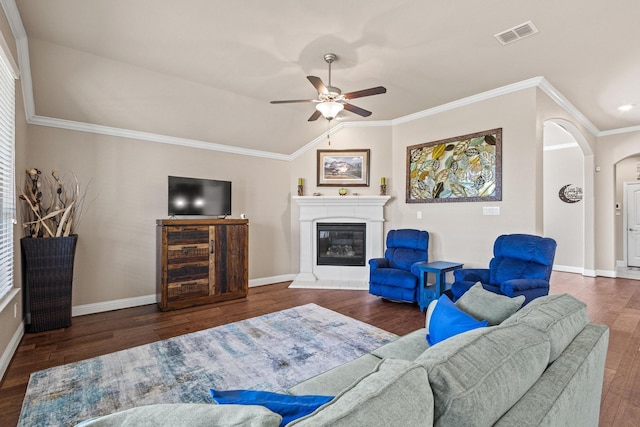 4304 Caney Creek Cir, Celina, TX 75078 - living room with arched walkways, wood finished floors, ceiling fan, a glass covered fireplace, and visible vents