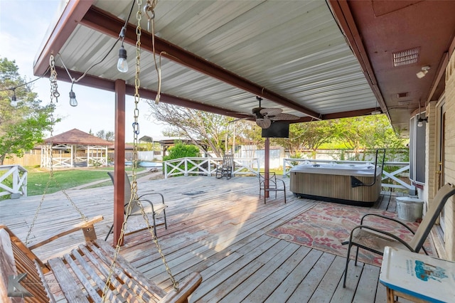 deck featuring a hot tub