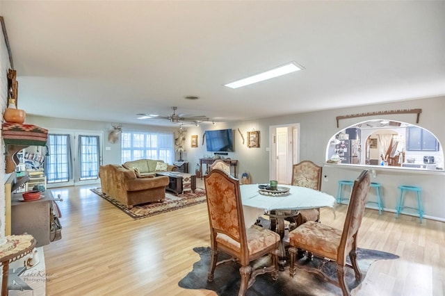 dining space featuring ceiling fan and wood finished floors