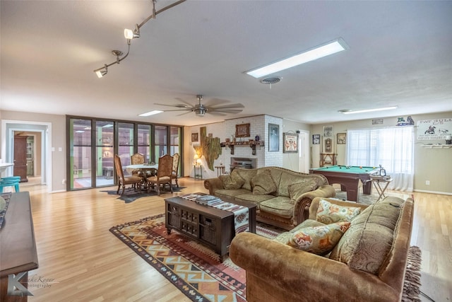 living room with baseboards, light wood-type flooring, billiards, a ceiling fan, and visible vents