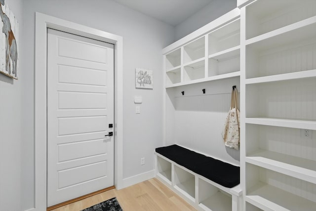 mudroom featuring baseboards and light wood-type flooring