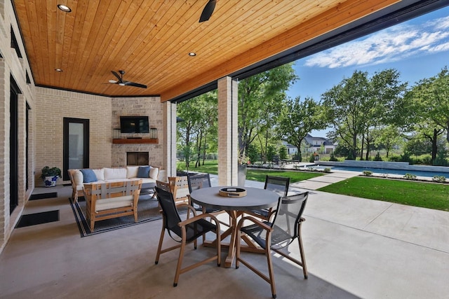 view of patio featuring an outdoor living space, ceiling fan, and outdoor dining space