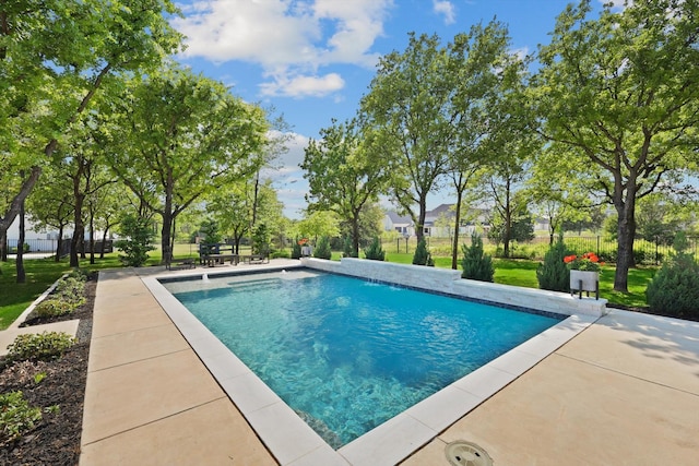 outdoor pool with a patio area