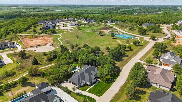 aerial view featuring a residential view and a forest view