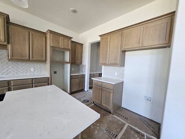 213 Pilot Dr, Caddo Mills, TX 75135 - kitchen with tasteful backsplash and light stone countertops