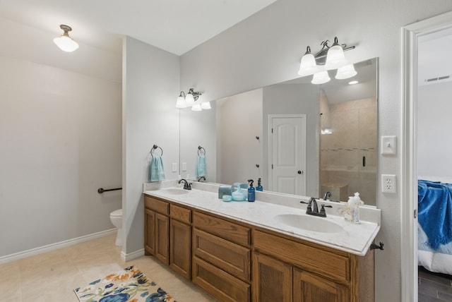 202 Hill Valley Dr, Stephenville, TX 76401 - ensuite bathroom featuring double vanity, ensuite bath, a sink, and a stall shower