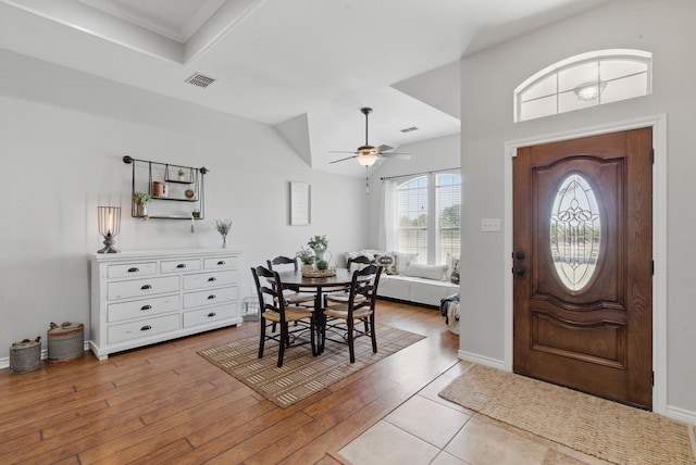 202 Hill Valley Dr, Stephenville, TX 76401 - foyer with visible vents, a ceiling fan, vaulted ceiling, and wood finished floors