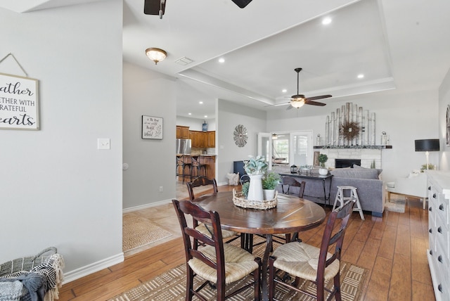 202 Hill Valley Dr, Stephenville, TX 76401 - dining room featuring ceiling fan, visible vents, recessed lighting, a raised ceiling, and hardwood / wood-style flooring