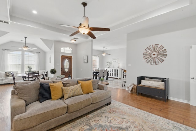 202 Hill Valley Dr, Stephenville, TX 76401 - living area featuring visible vents, ceiling fan, a raised ceiling, and hardwood / wood-style floors