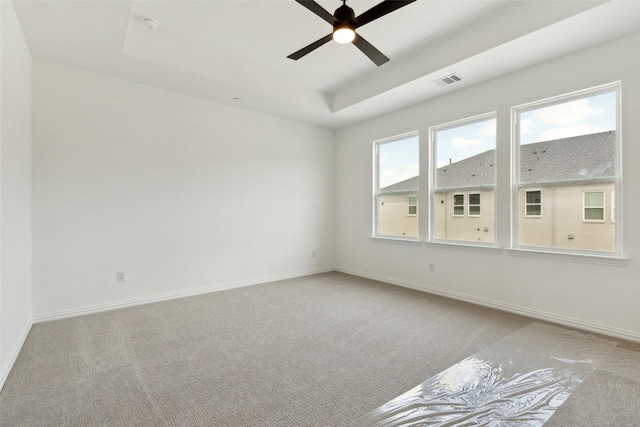 15712 Millwood Trl, Frisco, TX 75033 - empty room featuring a ceiling fan, a tray ceiling, visible vents, and carpet