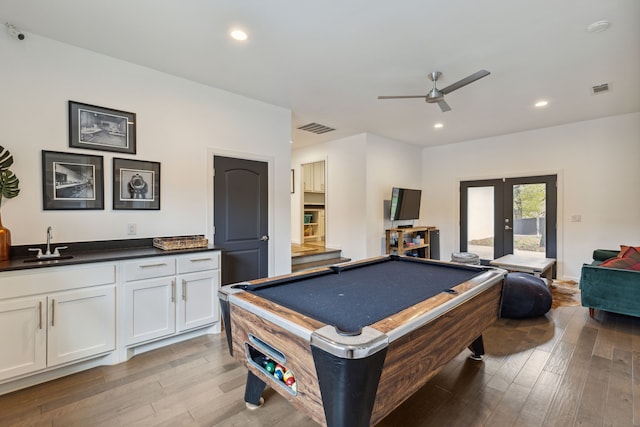 7342 Briar Rd, Azle, TX 76020 - recreation room with french doors, light wood-style flooring, a ceiling fan, visible vents, and a sink