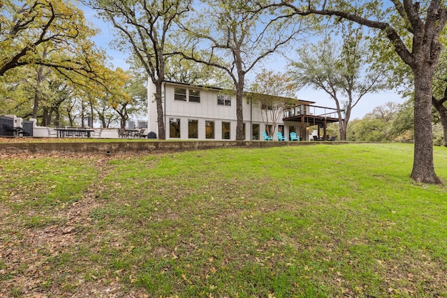 7342 Briar Rd, Azle, TX 76020 - back of house with a yard, a deck, and board and batten siding