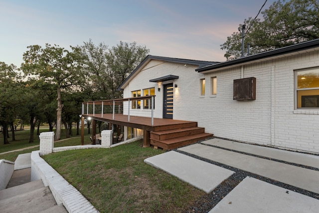 7342 Briar Rd, Azle, TX 76020 - back of property with brick siding, a deck, and a lawn