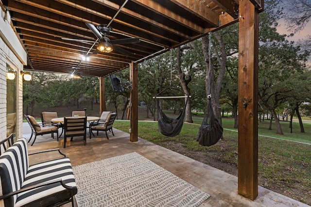 7342 Briar Rd, Azle, TX 76020 - patio terrace at dusk with outdoor dining area and a lawn