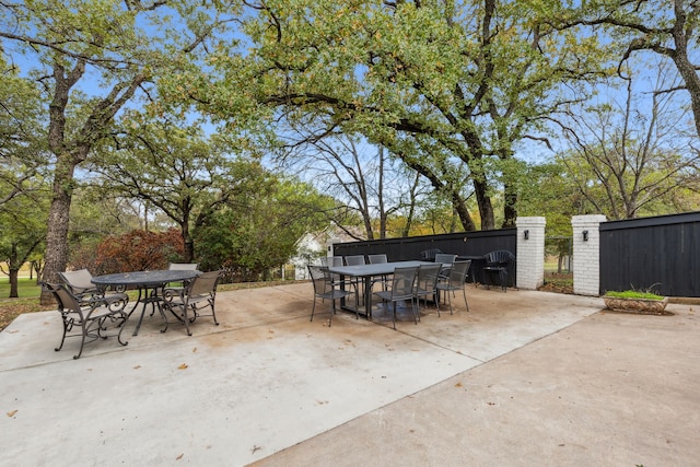 7342 Briar Rd, Azle, TX 76020 - view of patio / terrace featuring outdoor dining space, fence, and a gate