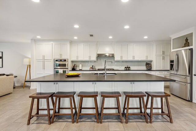 7342 Briar Rd, Azle, TX 76020 - kitchen featuring dark countertops, wall chimney range hood, visible vents, and stainless steel appliances