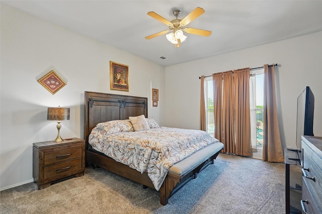 bedroom with light carpet, visible vents, and a ceiling fan