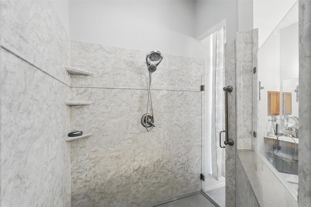 full bath with a marble finish shower