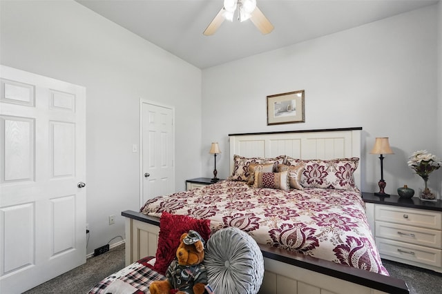 bedroom with dark carpet, ceiling fan, and baseboards