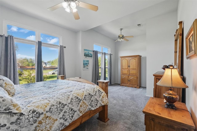 carpeted bedroom with visible vents and a ceiling fan