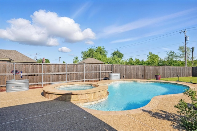 view of swimming pool featuring a fenced backyard, a fenced in pool, an in ground hot tub, and a patio area